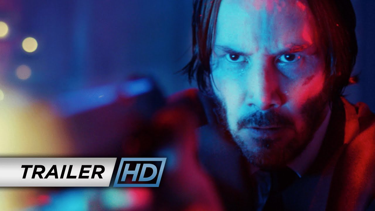 Keanu Reeves as John Wick in a blue-lit frame from the official John Wick trailer.
