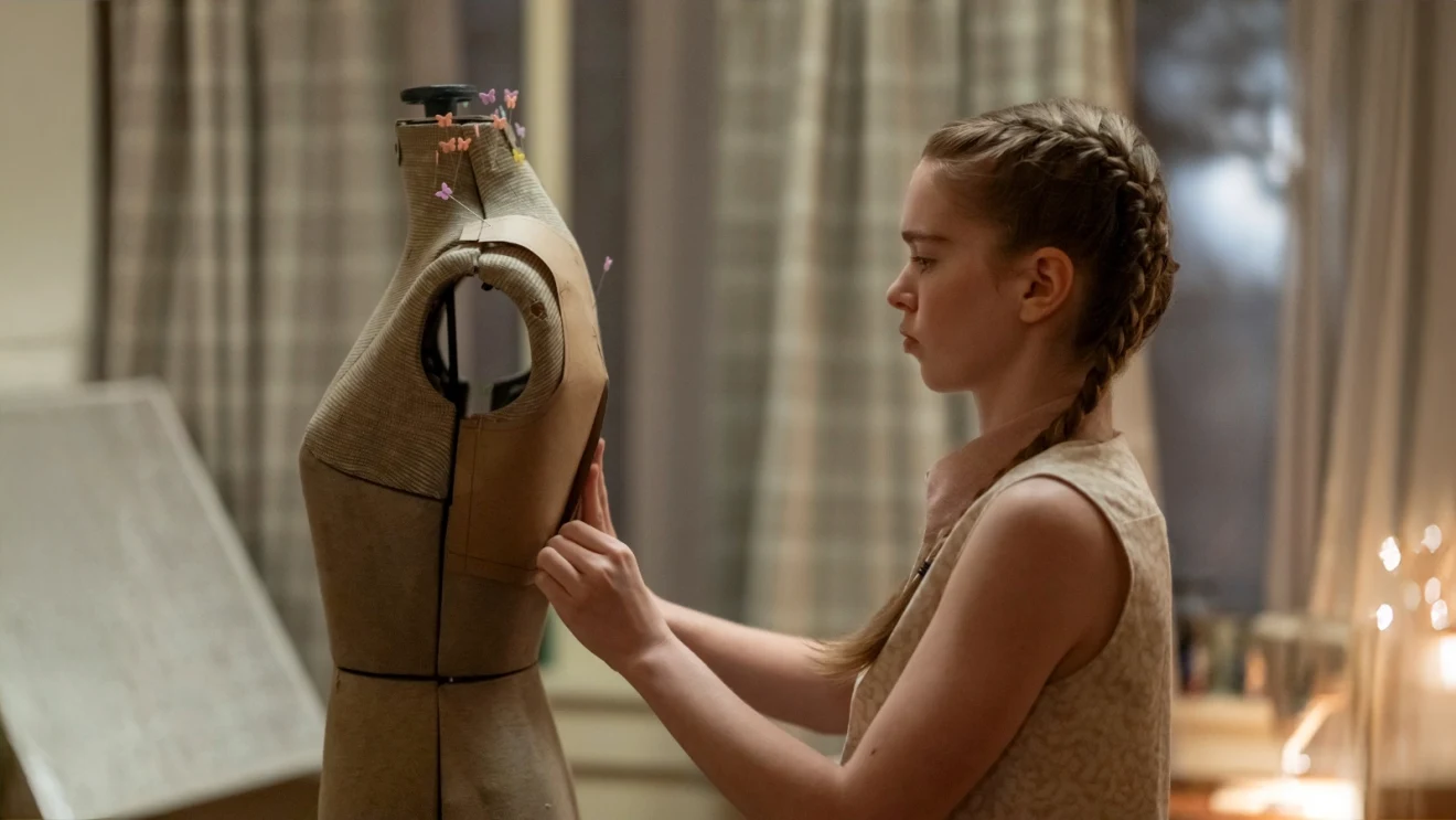 Summer H. Howell's Carrie working with a dress form in a 2026 official series still, representing the newest adaptation rather than the 1976 film.