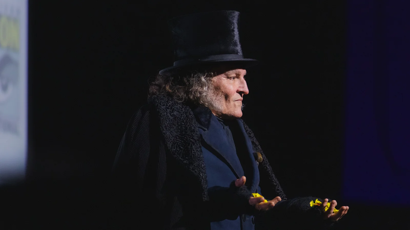 Johnny Depp appearing as Ebenezer Scrooge onstage at San Diego Comic-Con in 2026.