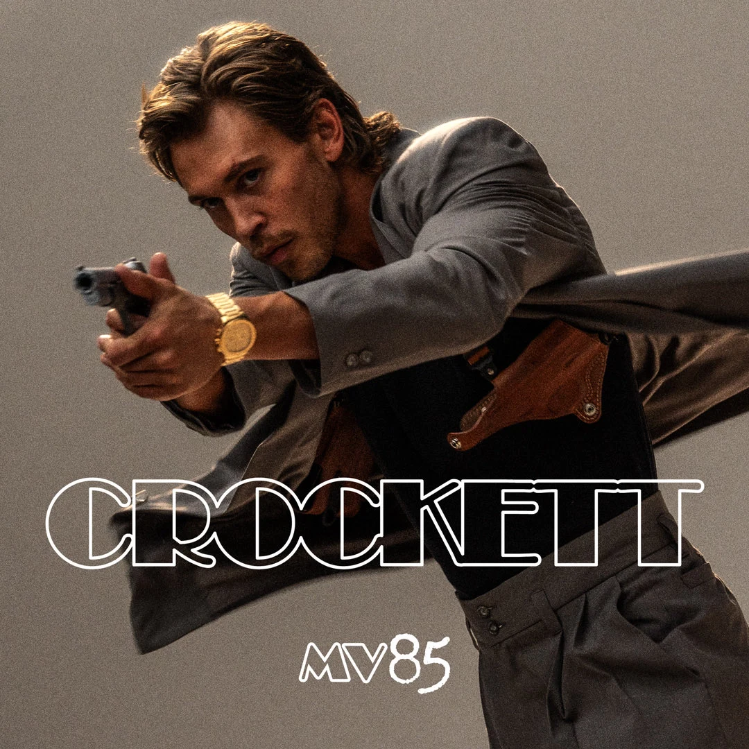 Austin Butler as Sonny Crockett aims a handgun in Universal Pictures’ first official Miami Vice ’85 character image.