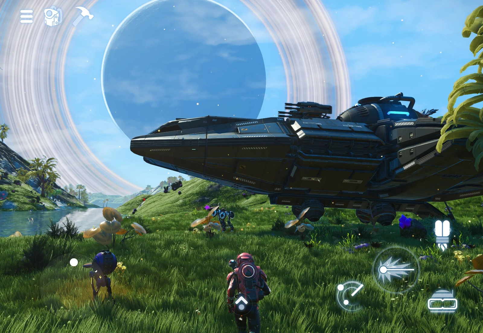 An explorer stands beside a large starship beneath a ringed planet in official No Man's Sky iPad gameplay, with touch-control icons visible around the screen.