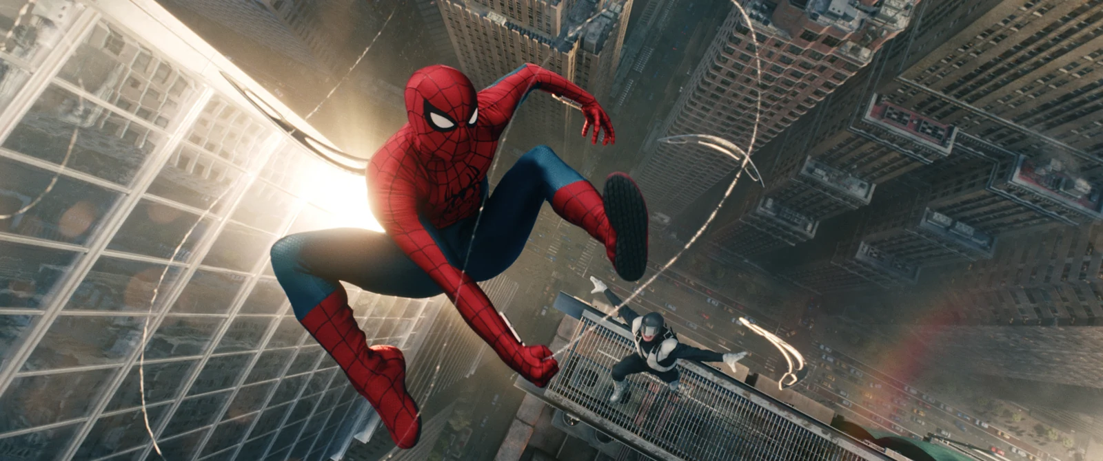 Tom Holland as Spider-Man swinging through New York City in Spider-Man: Brand New Day.