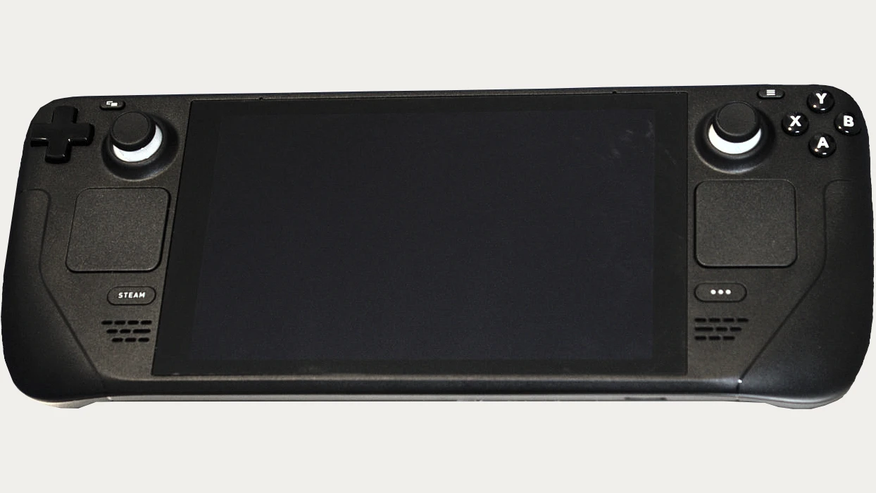 Front of a black LCD Steam Deck with its screen off.